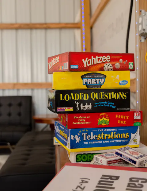 Stack of board games in the game room